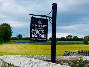 A black countryside sign advertising St Hilarys Vineyard in the Vale of Glamorgan